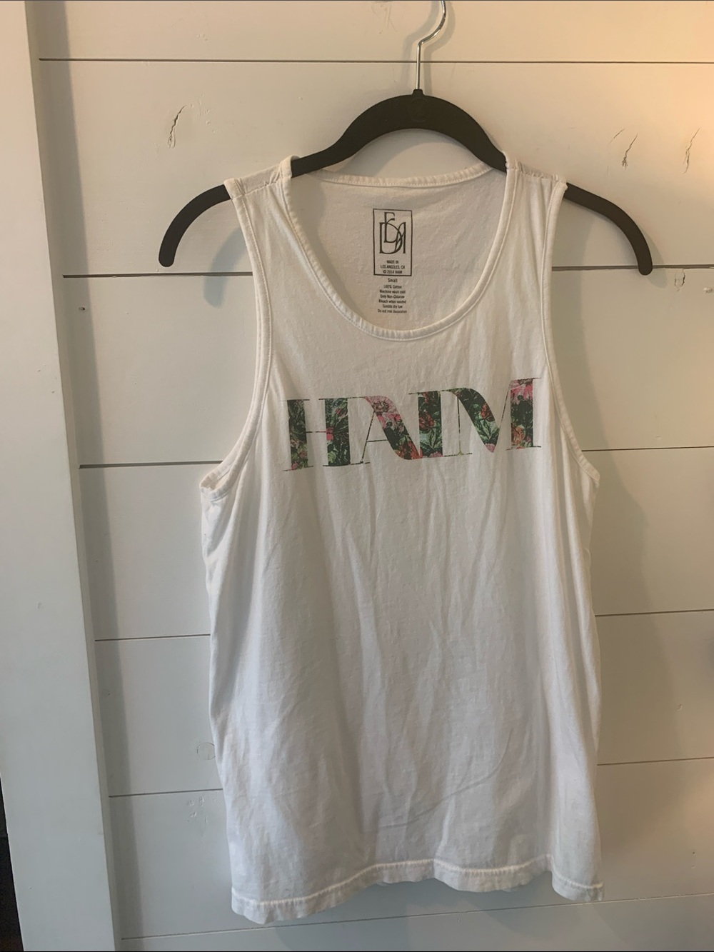 HAIM sleeveless t shirt from Coachella 
. Size Small. White Tank with flower